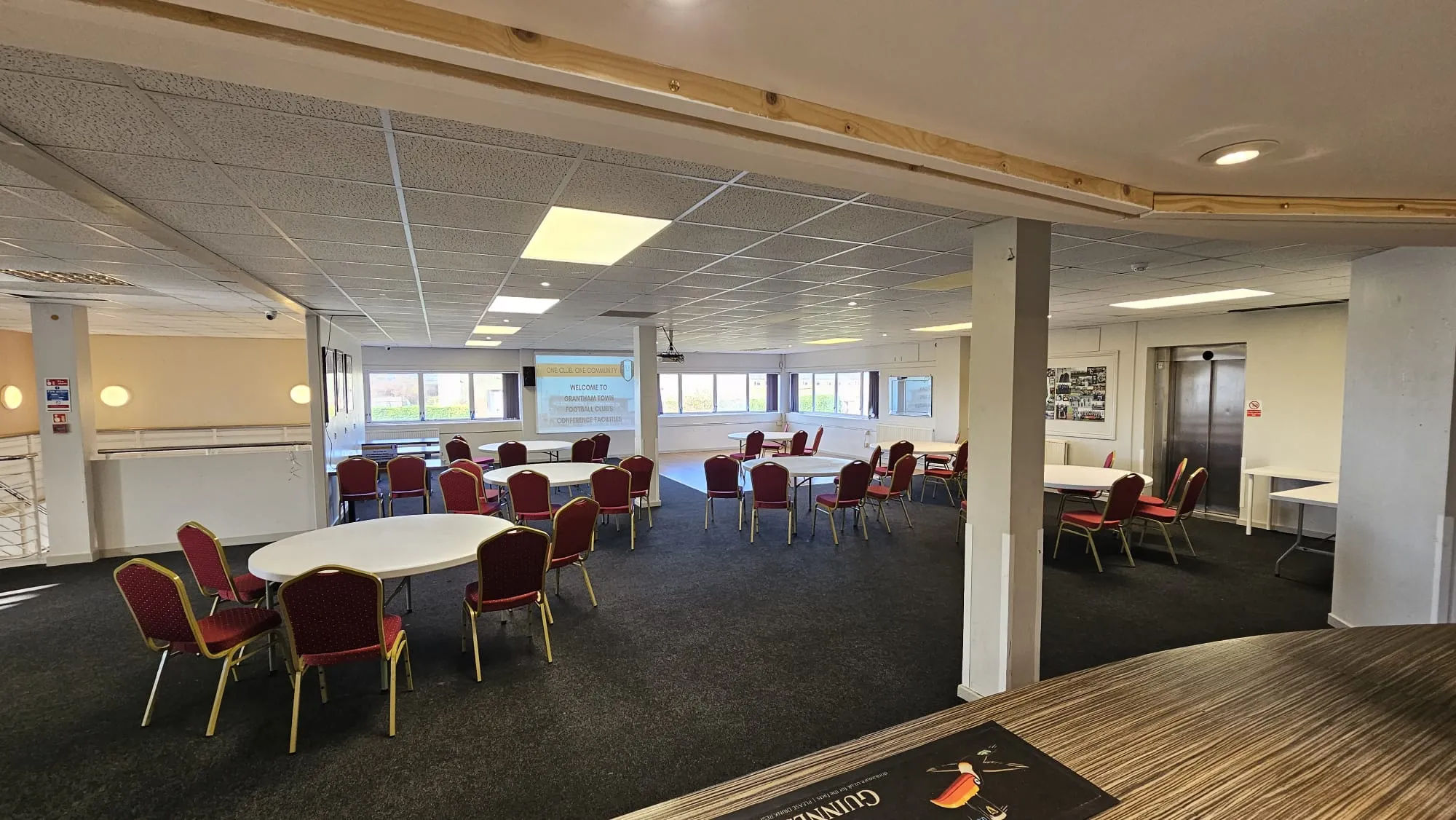 Function room with cabaret-style round tables and chairs